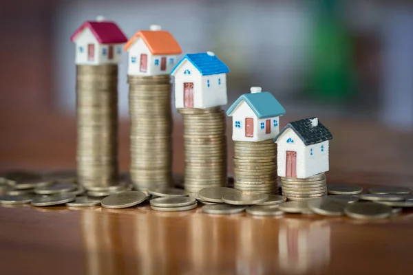 Mini house on stack of coins, Real estate investment, Save money with stack coin, Business growth investment and financial, Mortgage concept.