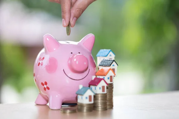Piggy bank, concept of saving money for house , Business Finance and Money concept,Save money for prepare in the future.