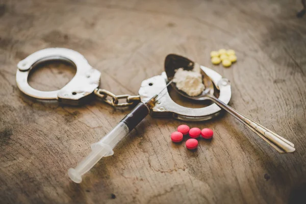 Handcuffs Drugs Syringes Wooden Table Law Police Concept World Drug — Stock Photo, Image