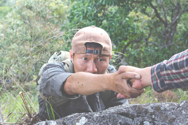 Couple hiking help each other, Rock Climbing, Mountain Climbing, Hiking