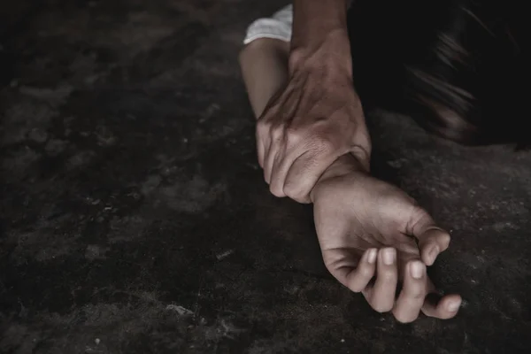 Close up of man hands holding a woman hands for rape and sexual — Stock Photo, Image