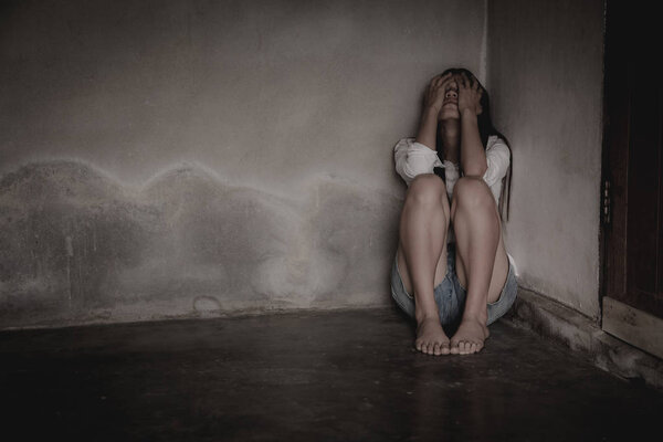 Woman lying on the floor crying with depression, Depressed woman