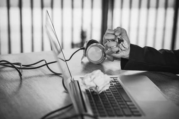 Business woman hands crumple sheets at the desk, mistake contrac