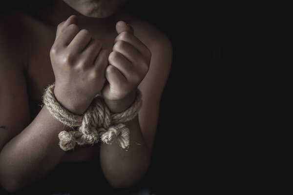 Hands tied up with rope of a missing kidnapped, abused, Violence