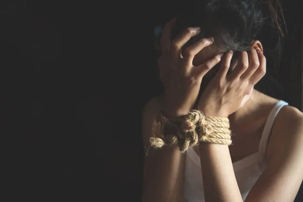 Scared young woman sitting in the corner of her bedroom, despair — Stock Photo, Image