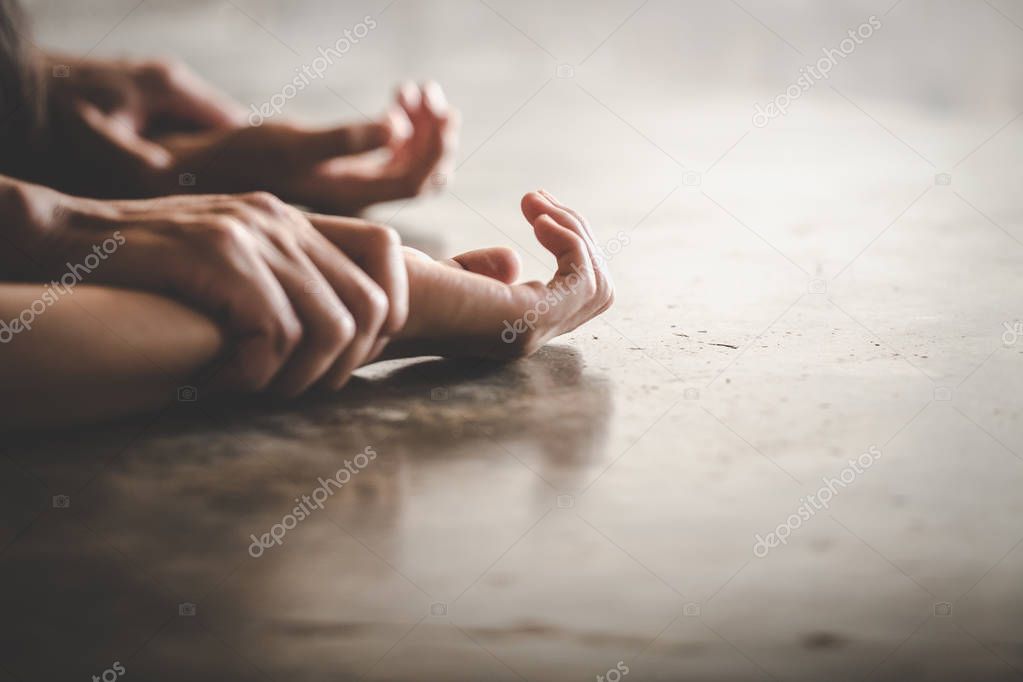Man's hand holding a woman hand for rape and sexual abuse concep