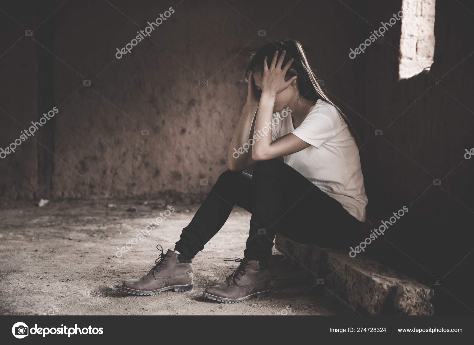 Sad and lonely girl crying with a hand covering her face. Stress ...