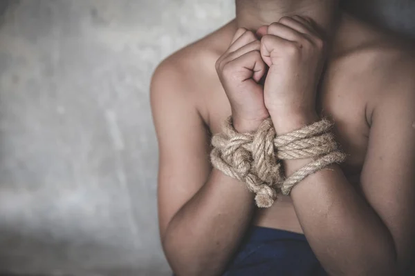 Victim boy with hands tied up with rope in emotional stress and — Stock Photo, Image