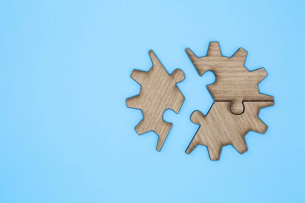 Wooden Jigsaw Puzzle  parts on blue background