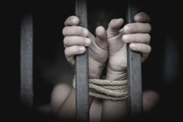 The child was tied up with a rope and was in a cell. Stop violen — Stock Photo, Image