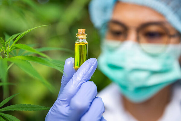Portrait of scientist with mask, glasses and gloves researching 