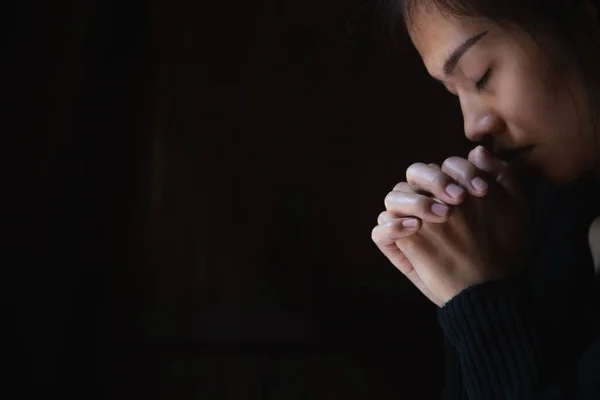 Christian woman praying worship. Hands folded in prayer,  worship god.