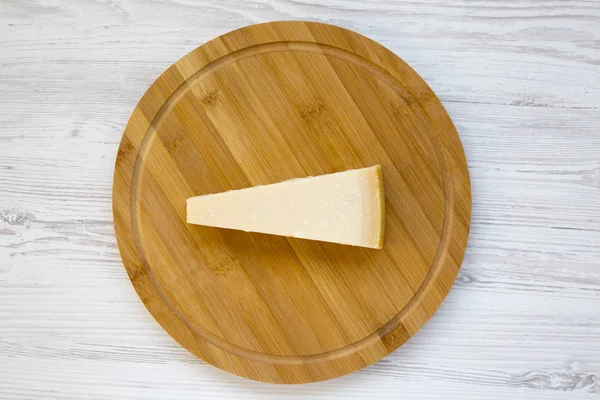 Piece Parmesan Cheese Bamboo Board White Wooden Background Top View — Stock Photo, Image