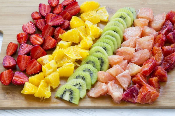 Chopped Fresh Raw Colorful Fruits Arranged Cutting Board White Wooden — Stock Photo, Image