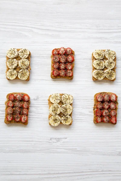 Toasts Peanut Butter Fruits Chia Seeds White Wooden Table Top — Stock Photo, Image