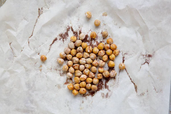 From above, roasted chickpeas with spices on paper