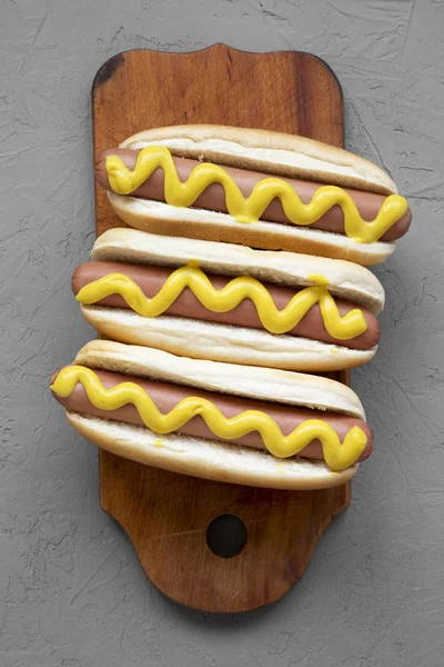 Tasty Hot Dogs Yellow Mustard Wooden Board Concrete Background Overhead — Stock Photo, Image
