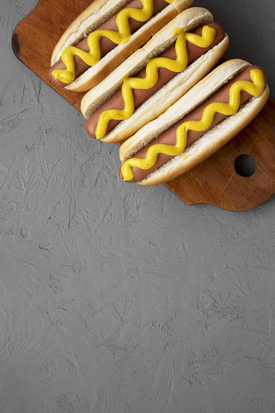 Tasty Hot Dogs Yellow Mustard Wooden Board Grey Background Overhead — Stock Photo, Image