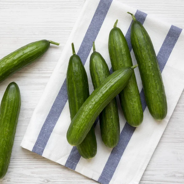 Fresh Raw Green Cucumbers White Wooden Table Top View Flat — Stock Photo, Image