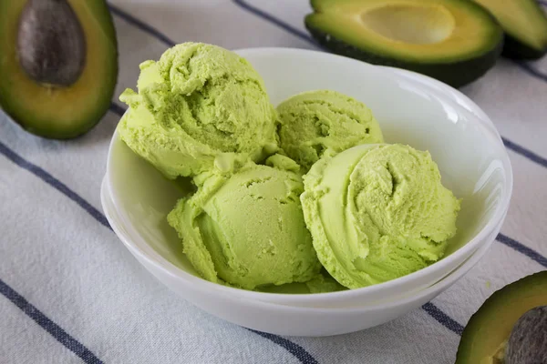 Homemade avocado ice cream in a bowl, close-up.