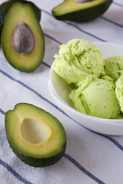 Homemade avocado ice cream in a bowl, closeup.
