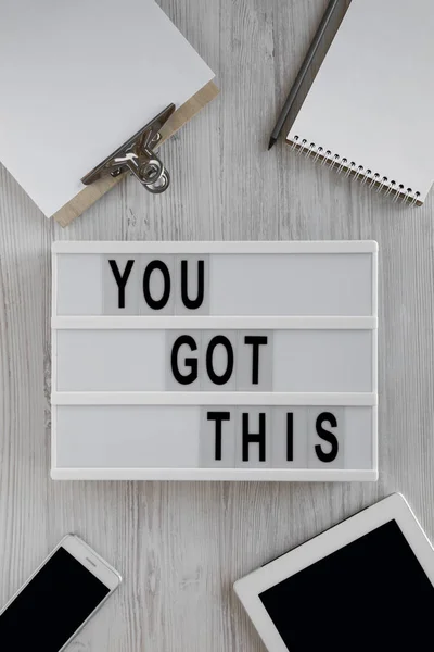 Modern board with 'You got this' words over white wooden backgro