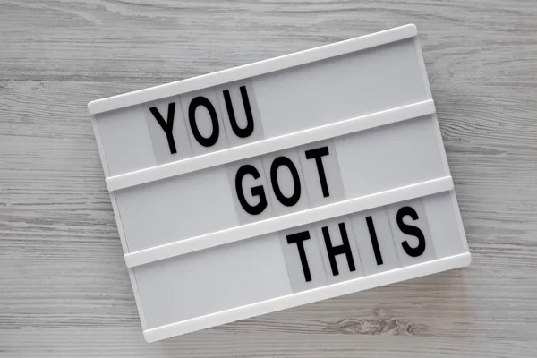 Lightbox with \'You got this\' words over white wooden background,