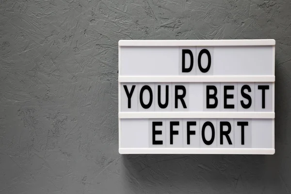 'Haz tu mejor esfuerzo' palabras en lightbox sobre fondo gris, a — Foto de Stock
