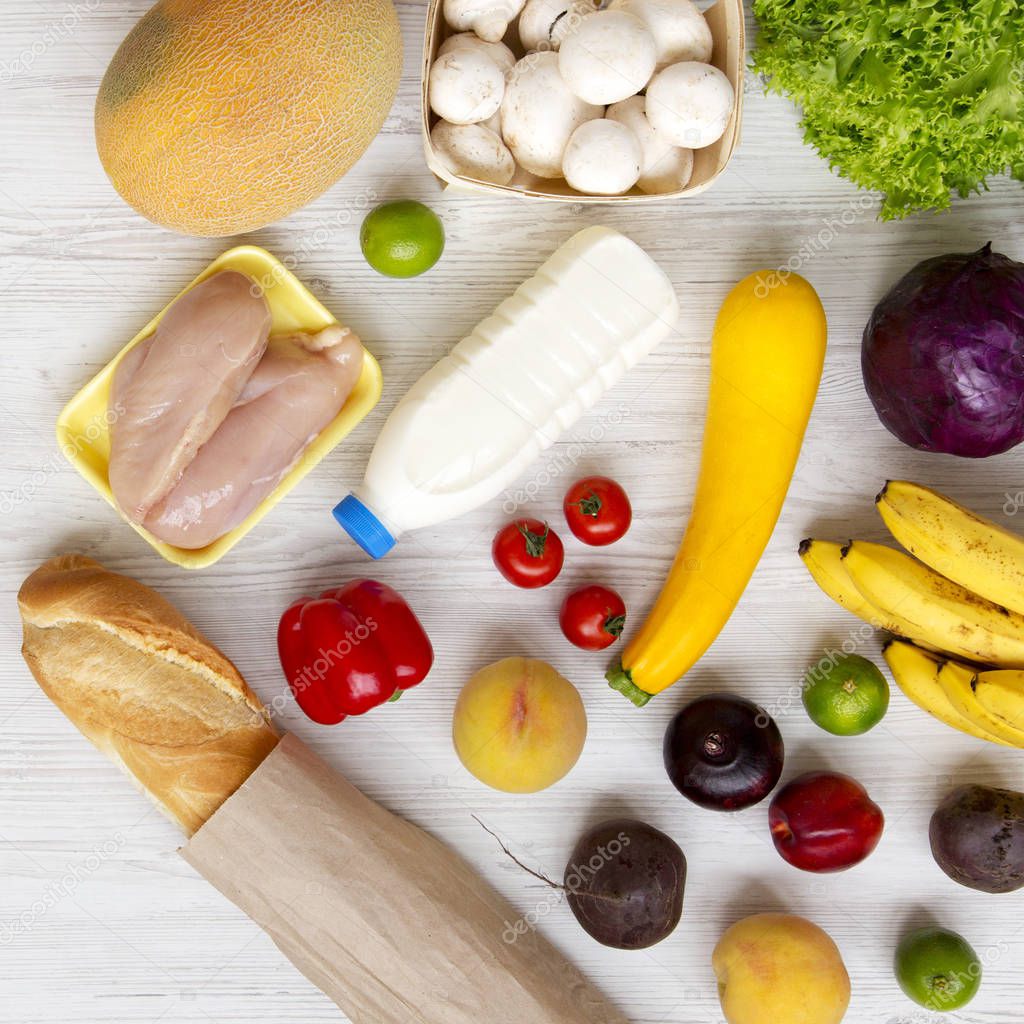 Set of various healthy food on a white wooden table, top view. C