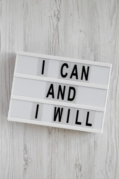 Modern board with 'I can and I will' words on a white wooden bac — Stock Photo, Image