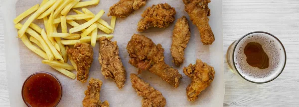 Fastfood: fried chicken legs, spicy wings, French fries and chic
