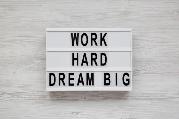 Modern board with 'Work hard dream big' words on a white wood — Stok Foto