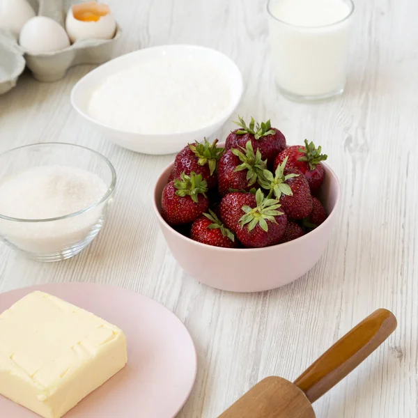 Strawberry pie ingredients (flour, eggs, butter, milk, sugar, st