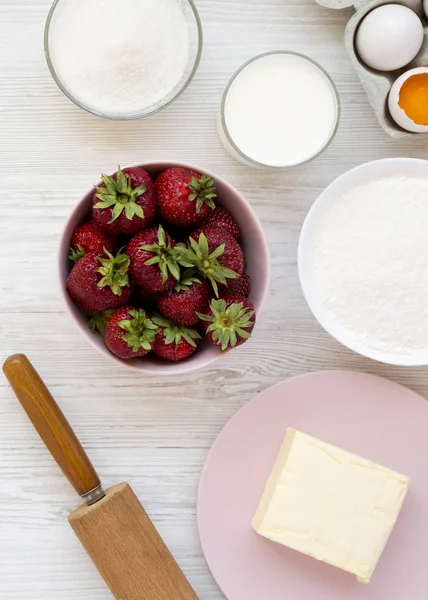 Strawberry pie ingredients (flour, eggs, butter, milk, sugar, st
