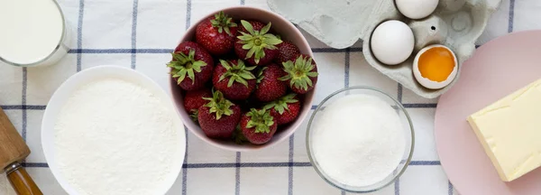 Strawberry pie ingredients (flour, eggs, butter, milk, sugar, st