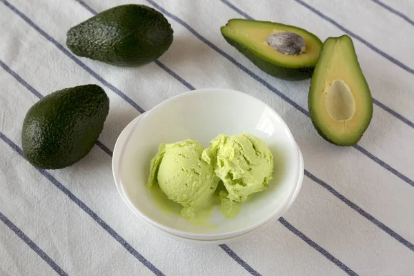 Homemade avocado ice cream in a bowl, low angle view. Close-up.