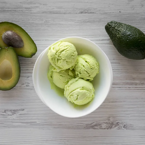 Homemade tasty avocado ice cream in a bowl, top view. Overhead,