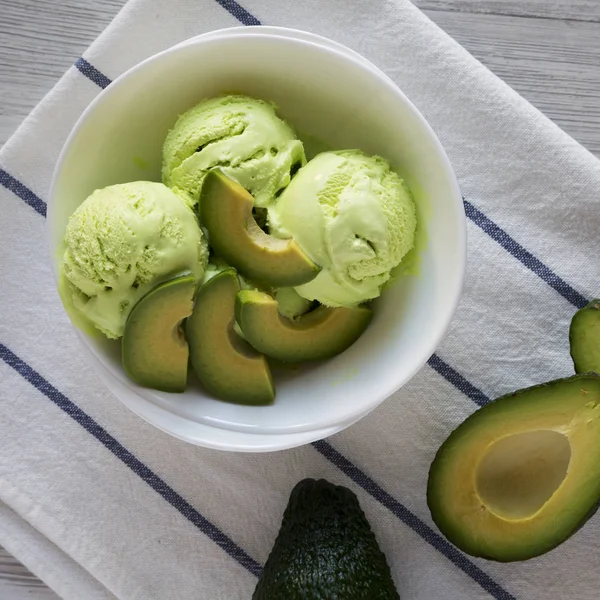 Homemade avocado ice cream in a bowl, overhead view. Top view, f