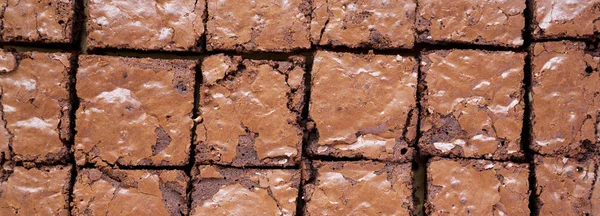 Homemade chocolate brownies on a baking sheet, top view. Overhea — Stock Photo, Image