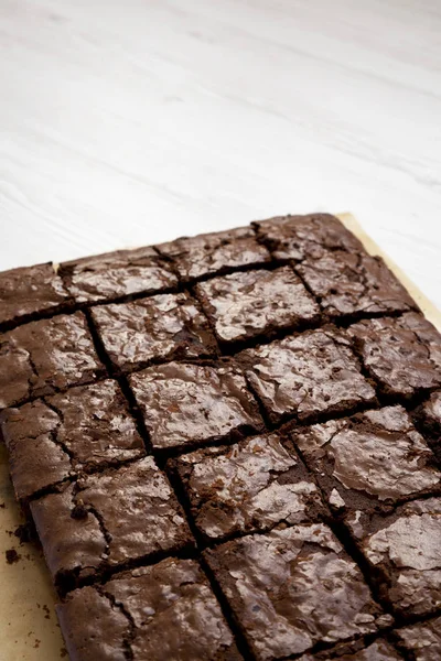 Homemade chocolate brownies, low angle view. Copy space. — Stock Photo, Image