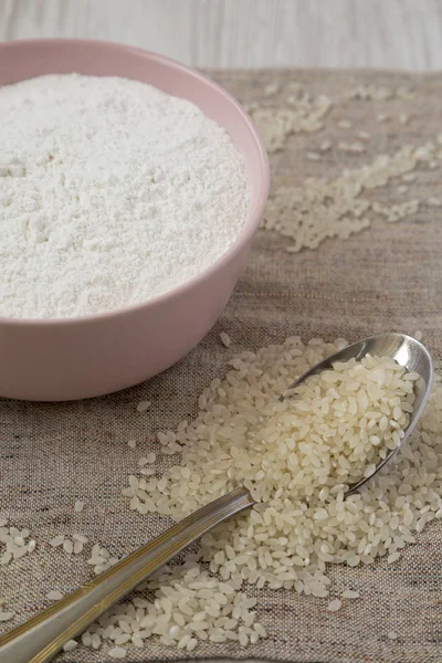 Gluten free rice flour in a pink bowl, side view. Closeup. — Stock Photo, Image