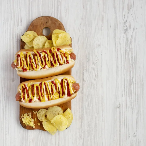 Homemade colombian hot dogs with pineapple sauce, yellow mustard