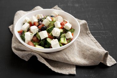 Homemade Shepherds salad with cucumbers, parsley and feta in a w clipart