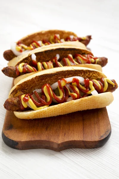 Homemade hot dogs with chicken sausage, ketchup and mustard on a — Stock Photo, Image