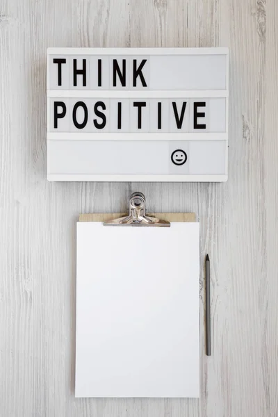 'Think positive' words on a modern board, clipboard with blank s — ストック写真