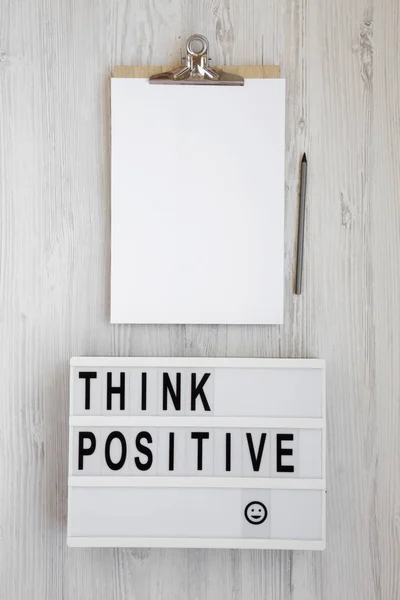 'Think positive' words on a modern board, clipboard with blank s — Stock Photo, Image