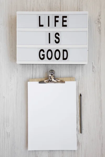 'Life is good' words on a modern board, clipboard with blank she — ストック写真