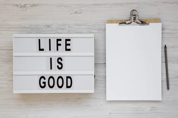 'Life is good' words on a modern board, clipboard with blank she — ストック写真