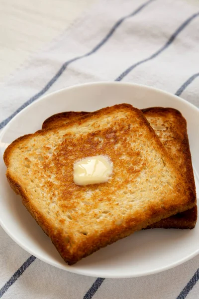 Homemade Buttered Toast White Plate Low Angle View — Stock Photo, Image