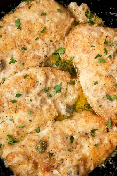 Homemade Italian Chicken Piccata Cast Iron Pan Top View Overhead Stock Picture